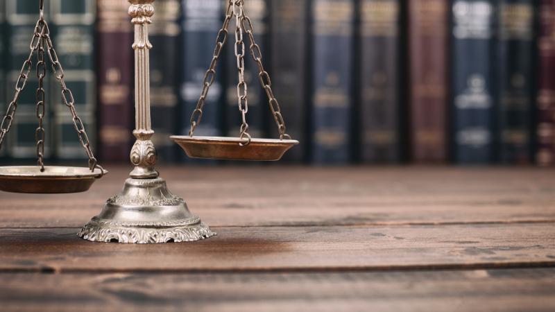 photo of scales of justice and books